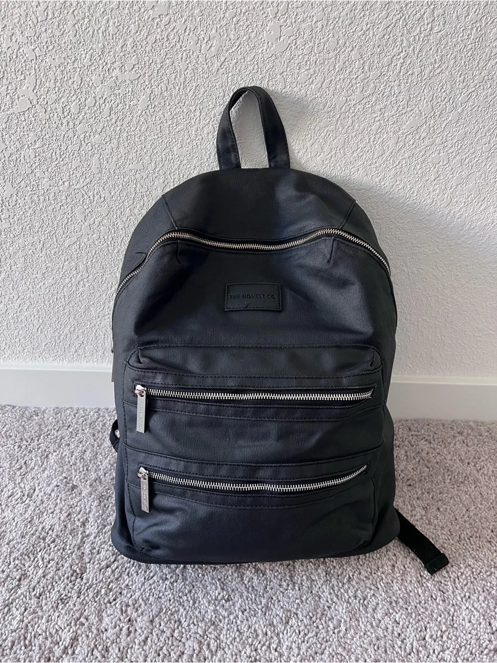 Black diaper backpack by The Honest Company